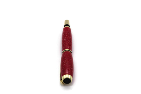 Kugelschreiber rote Granit-Optik vertikal — glitzernder Schaft, goldene Zierringe, schwarze Kappen-Enden