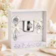 Taufgeschenk mit Engelmotiv aus 925 Silber: 3-teiliges Set mit Becher, Babyrassel und Schnuller in festlichem Ambiente