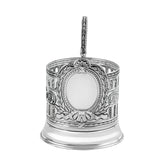 Podstakannik Patron antik patiniert 925 Silber Frontalansicht — leeres ovales Wappenmedaillon umrahmt von Lorbeerkranz und Schleife, Säulenstruktur, Akanthus-Voluten, Schwärzung in den Vertiefungen, ideal für persönliche Gravur (Initialen, Wappen, Logo)