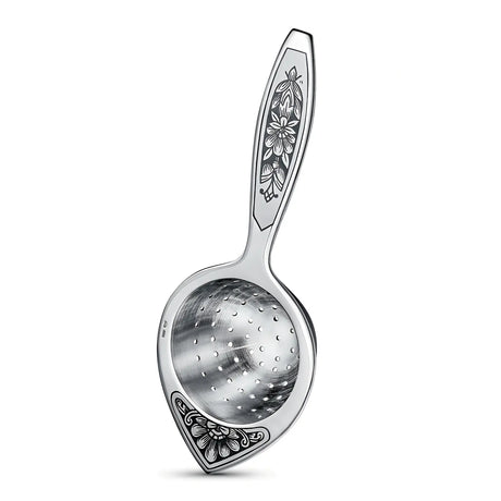 „Aurora Silber" – Teesieb aus Silber mit Niello